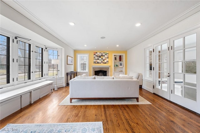 3006 Kingsley Rd, Shaker Heights, OH 44122 - living area featuring ornamental molding, recessed lighting, a fireplace, french doors, and wood finished floors