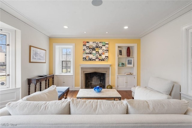 3006 Kingsley Rd, Shaker Heights, OH 44122 - living room with crown molding, built in features, recessed lighting, a fireplace, and wood finished floors