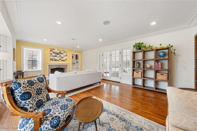 3006 Kingsley Rd, Shaker Heights, OH 44122 - living room featuring recessed lighting, wood finished floors, a fireplace, and crown molding