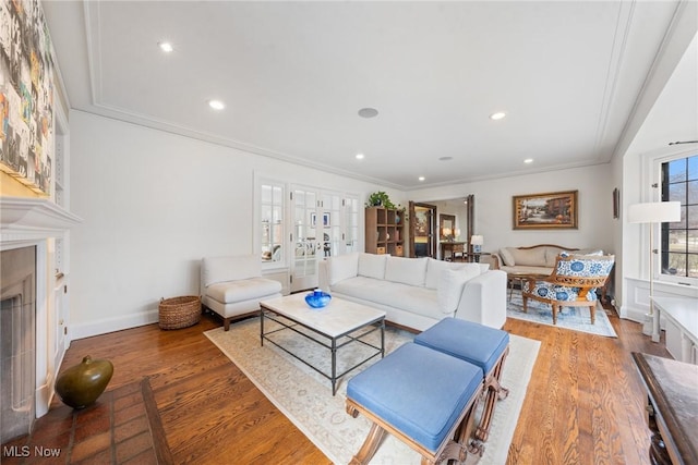 3006 Kingsley Rd, Shaker Heights, OH 44122 - living room featuring wood finished floors, a fireplace, and ornamental molding