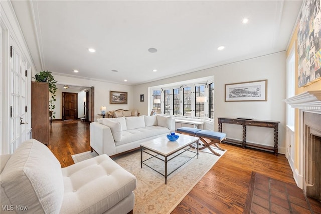 3006 Kingsley Rd, Shaker Heights, OH 44122 - living room featuring wood finished floors, recessed lighting, a fireplace, and ornamental molding
