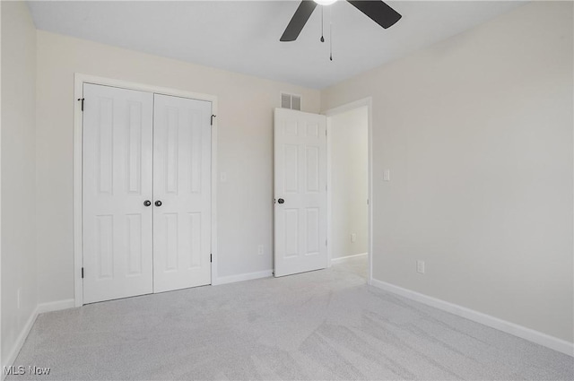 unfurnished bedroom with visible vents, baseboards, ceiling fan, a closet, and carpet flooring