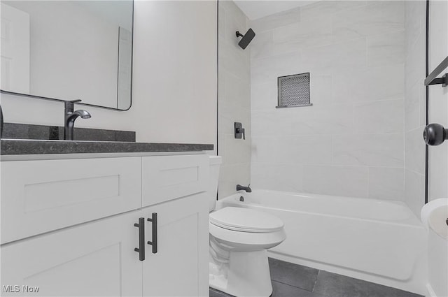 full bath with vanity,  shower combination, toilet, and tile patterned flooring