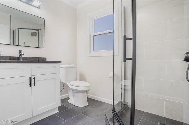 bathroom featuring tile patterned flooring, a shower stall, vanity, and toilet