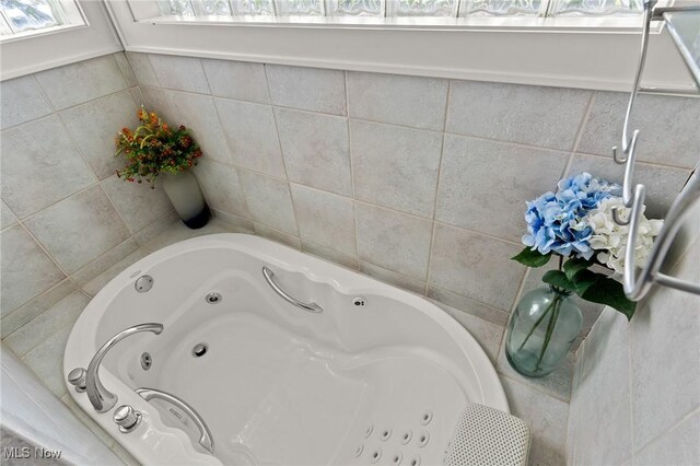 bathroom with a jetted tub