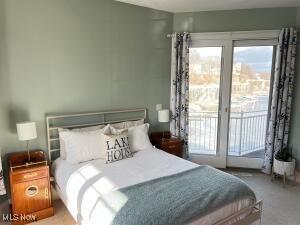 carpeted bedroom with access to outside