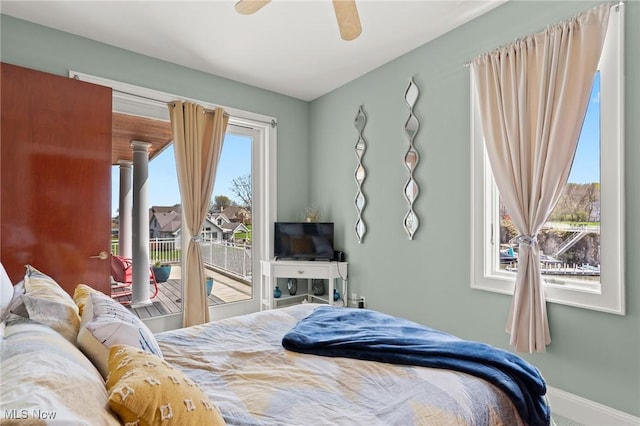 bedroom featuring access to exterior, ceiling fan, and baseboards