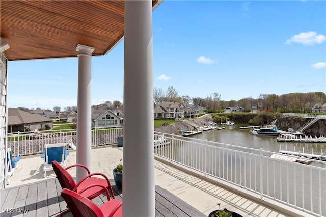 exterior space with a residential view and a water view