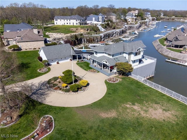 bird's eye view with a residential view and a water view