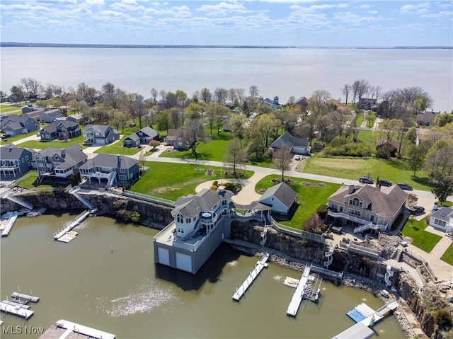 aerial view featuring a residential view and a water view