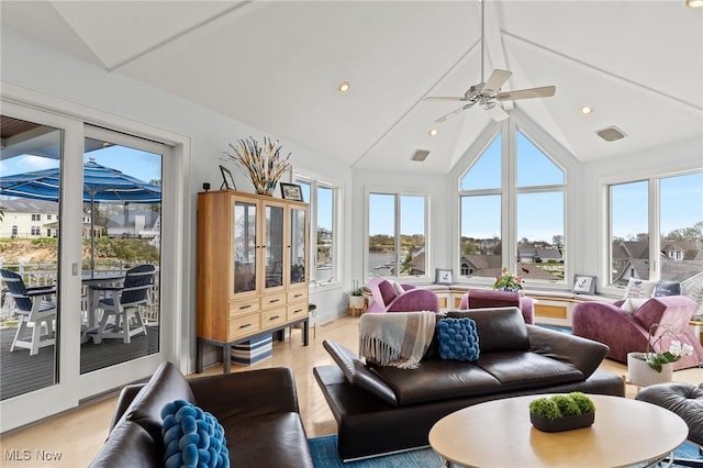 sunroom featuring lofted ceiling and ceiling fan