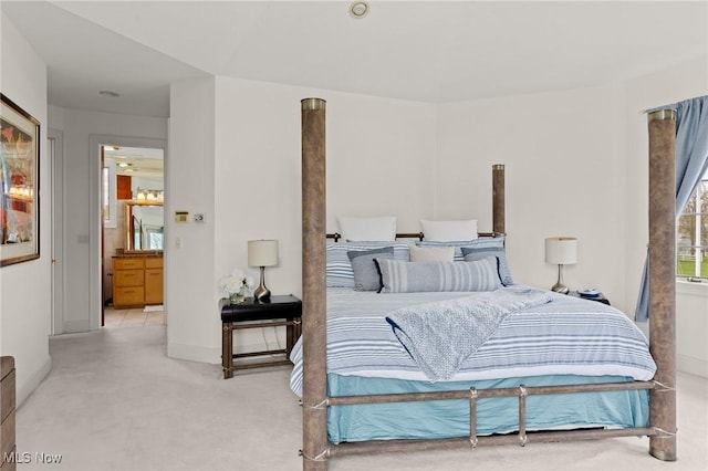 bedroom featuring light carpet and baseboards