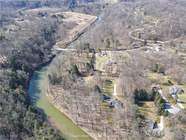 aerial view featuring a wooded view