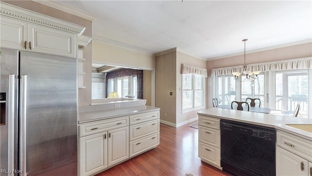 kitchen with wood finished floors, dishwasher, crown molding, stainless steel fridge, and a wealth of natural light