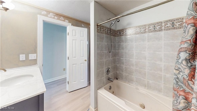 full bathroom with vanity, shower / tub combo, and wood finished floors