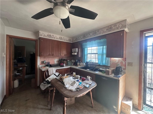 kitchen with tasteful backsplash, a ceiling fan, and light countertops