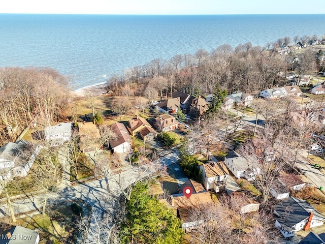 drone / aerial view featuring a water view and a residential view