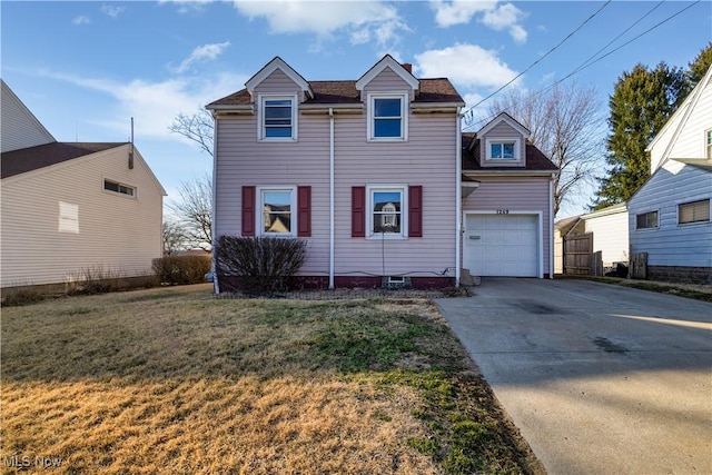 traditional-style home with a garage, driveway, and a front lawn