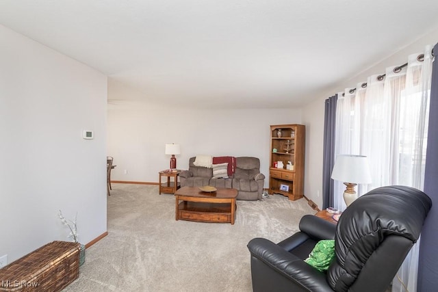 living room with carpet flooring and baseboards