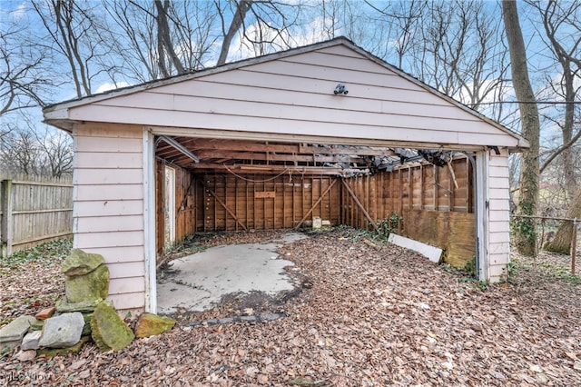 garage with fence