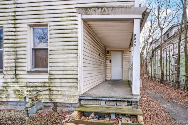 property entrance featuring fence