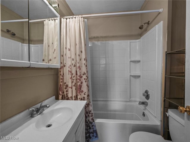 bathroom featuring vanity, toilet, and shower / tub combo with curtain