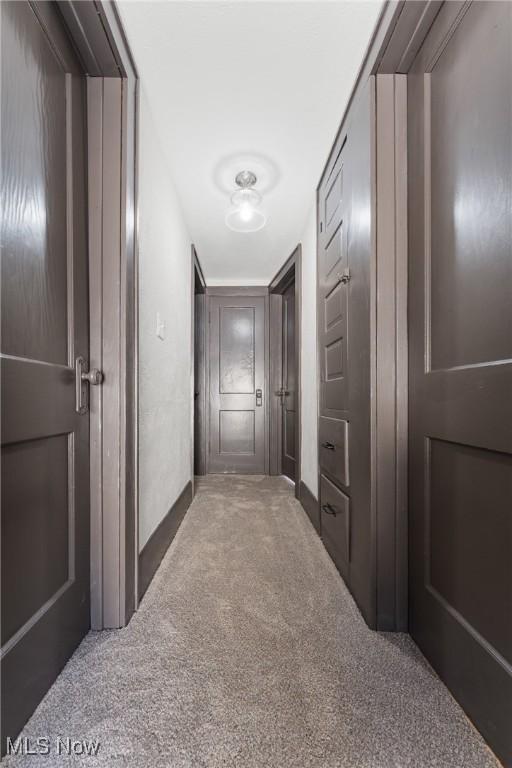 corridor featuring carpet flooring