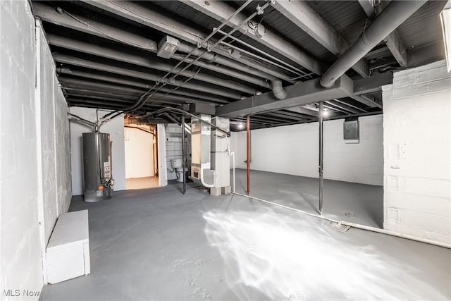 unfinished basement featuring electric panel and water heater