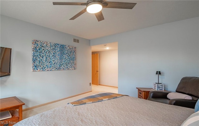 carpeted bedroom featuring visible vents, a ceiling fan, and baseboards