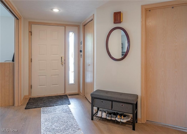 entrance foyer with recessed lighting, baseboards, and light wood-style flooring