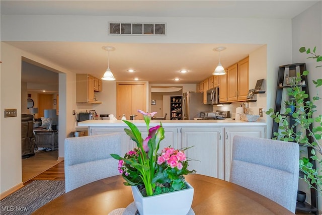 dining space with visible vents, recessed lighting, and dark wood-type flooring