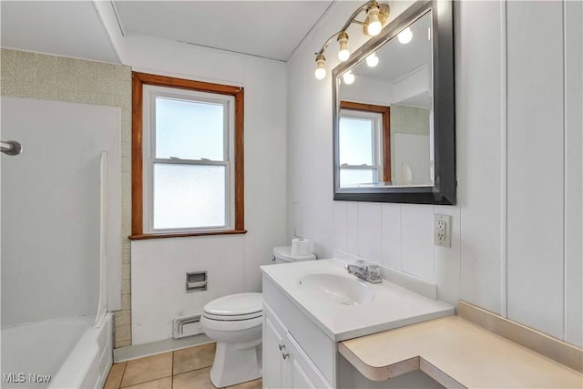 bathroom featuring tile patterned floors, toilet, shower / washtub combination, a baseboard radiator, and vanity