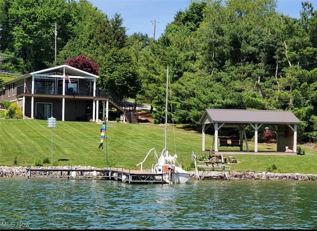 view of dock featuring a gazebo, stairway, a yard, and a water view