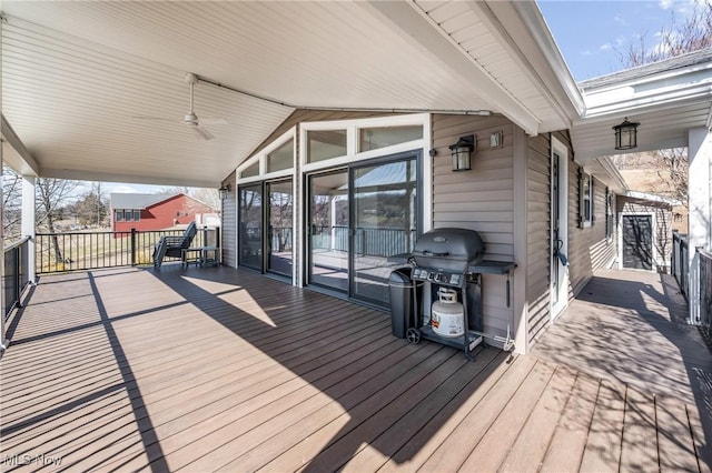 wooden deck featuring area for grilling