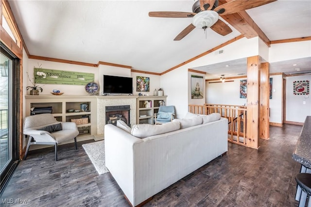 living room featuring dark wood-style floors, a fireplace, vaulted ceiling with beams, and ceiling fan