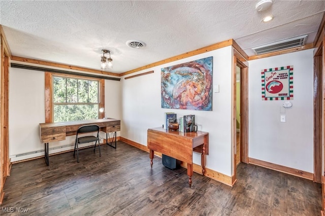 office space featuring visible vents, wood finished floors, baseboards, and a baseboard radiator