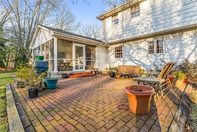 view of patio featuring a sunroom