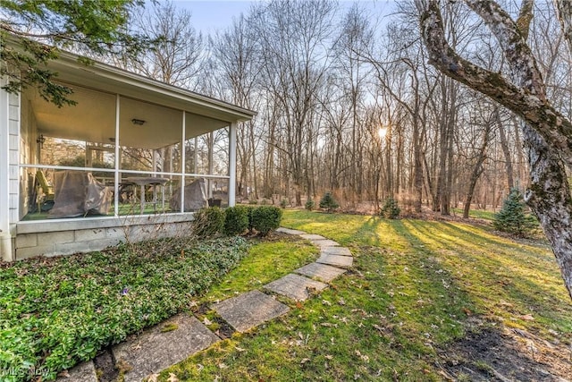 view of yard featuring a sunroom