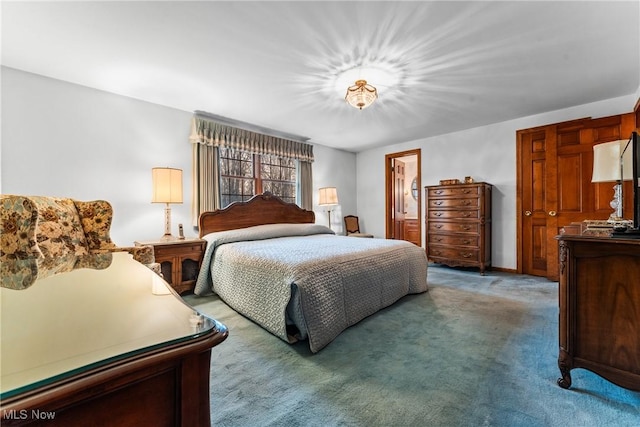 bedroom featuring light colored carpet