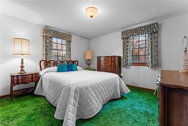 bedroom featuring baseboards and carpet floors