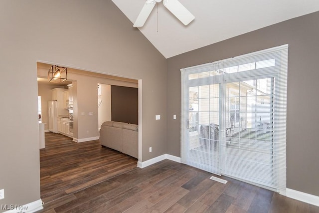 unfurnished room with baseboards, high vaulted ceiling, ceiling fan, and dark wood-style flooring