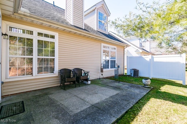 view of patio with fence and central AC