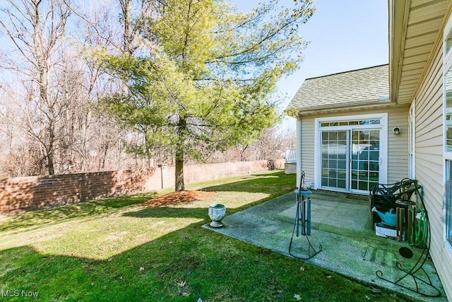 view of yard featuring a patio area and fence