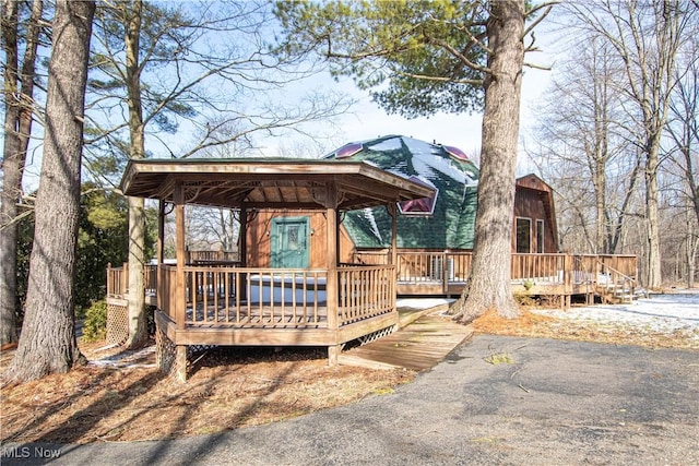 wooden terrace with a gazebo