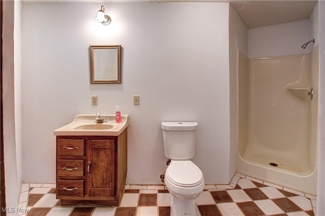 full bath with tile patterned floors, toilet, walk in shower, and vanity