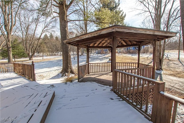 snow covered deck featuring a gazebo