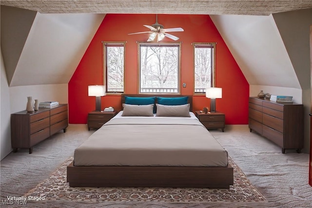 bedroom featuring light carpet and vaulted ceiling