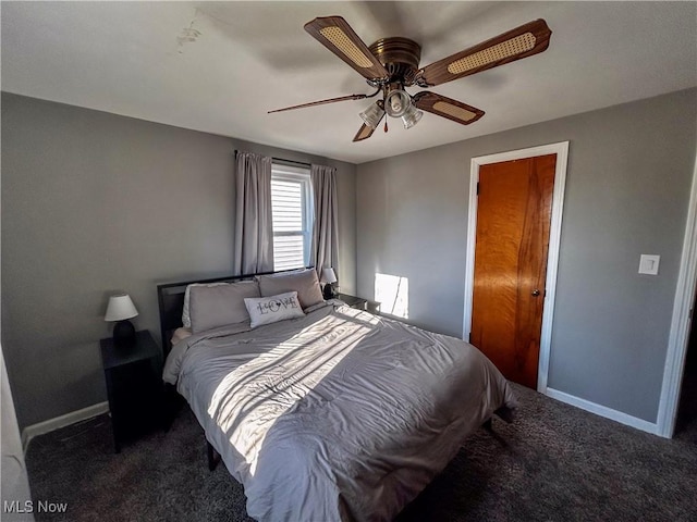 bedroom featuring ceiling fan, baseboards, and carpet floors