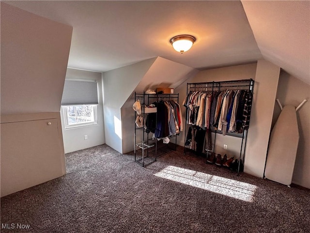 carpeted bedroom featuring lofted ceiling