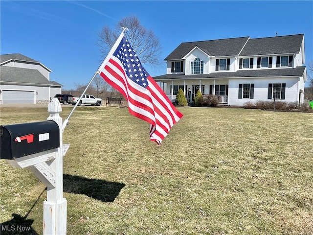 view of front of home with a front yard and covered porch